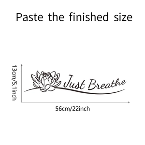 Detail view of lotus wall decal with Just Breathe quote measuring 56x13 cm in black