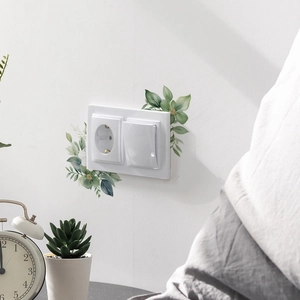 Green leaf and flower wall stickers for light switch decoration in cozy home interior