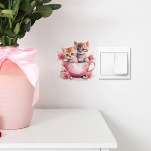 Detailed wall sticker view featuring cute kittens in pink teacups on a white wall