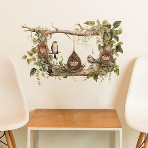 Detail view of bird nest wall decals on a living room wall with wooden furniture