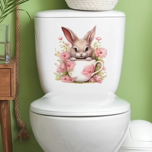 Cartoon rabbit in a teacup floral sticker on a white toilet tank for bathroom decor