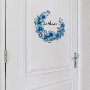 Blue floral wreath bathroom wall sticker on white wooden door with self-adhesive design