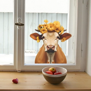 Creative static cling window sticker with a cow wearing a yellow flower garland decoration