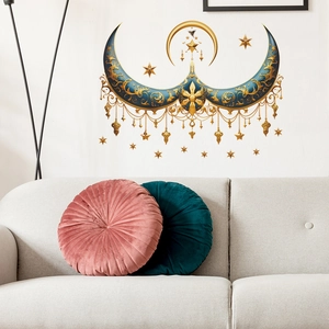 Exotic blue moon wall decal with gold floral patterns above a sofa with pillows