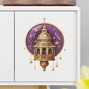 Detail of Ramadan lantern wall sticker with gold stars on a modern white cabinet