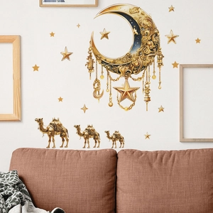 Golden Ramadan moon and camel wall stickers displayed above a cozy sofa in a living room