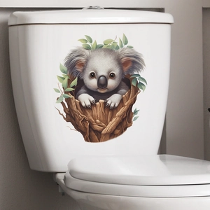 3D cartoon koala on a branch wall sticker applied on a white bathroom toilet tank