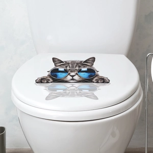 Detailed view of 3D cat wall sticker with blue sunglasses on a white toilet lid