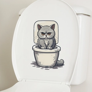 Gros plan d'un autocollant chat en colère sur un couvercle de toilette pour salle de bain