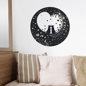 Detail of black silhouette wall sticker with cats and heart moon in cozy bedroom