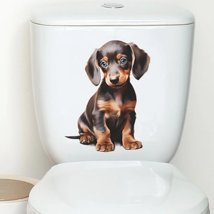 Sticker mural 3D réaliste chiot teckel posé sur un réservoir de WC en céramique blanche