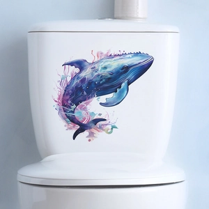 Watercolor blue whale decal on a white toilet tank for minimalist bathroom decoration