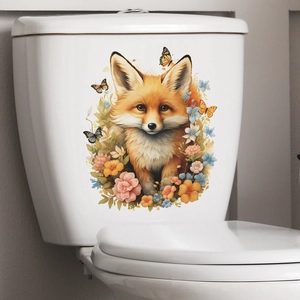 Detailed close-up of cartoon fox and floral toilet wall decals on white ceramic surface