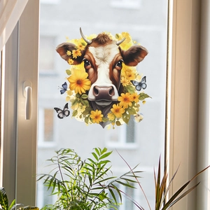 Cow head wall sticker with yellow flowers and blue butterflies on a glass window