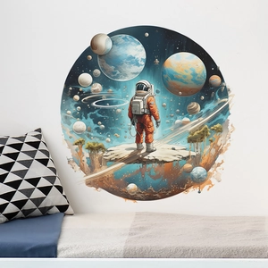 Detail of round space wall sticker featuring an astronaut and planets for bedroom decor