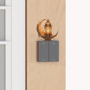 Close-up of golden Ramadan moon and lantern wall sticker above a light switch