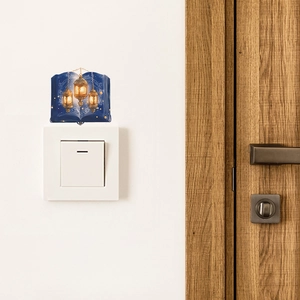 Adesivo murale con libro blu e lanterne dorate per decorazione interruttore casa