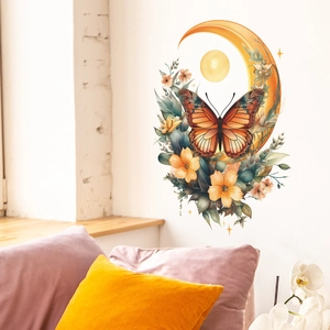 Détail d'un stickers mural avec lune orange et papillon sur un mur blanc de salon moderne