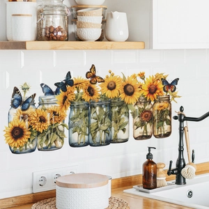 Colorful sunflower and butterfly wall decals with mason jars on a white tiled kitchen wall