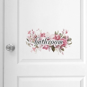 Detailed view of floral bathroom wall sticker with pink roses on a white door