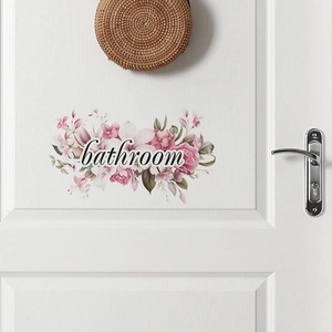 Floral bathroom door sticker with pink flowers and script text on white wood door