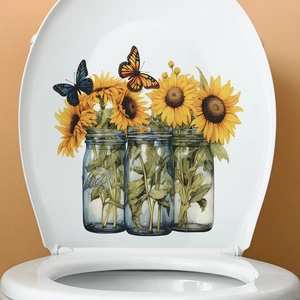 Detail view of sunflower mason jar decals with butterflies on a white toilet cover