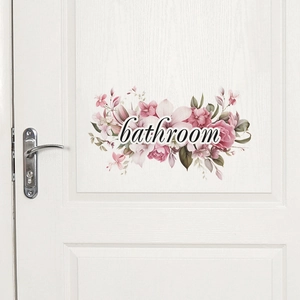 Floral bathroom door sticker with pink flowers and romantic script on a white wood door