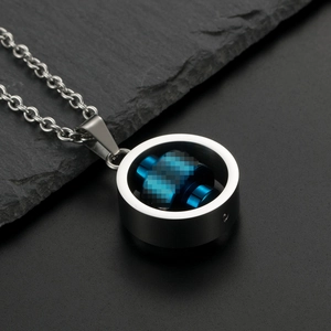 Macro shot of a spinning rotatable blue and silver titanium steel industrial necklace