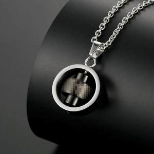 Titanium steel necklace featuring a rotating silver ring pendant with black industrial core