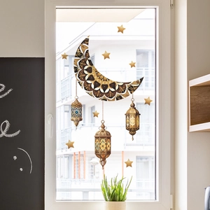 Detail of Ramadan window stickers featuring mandala moon and lanterns on glass