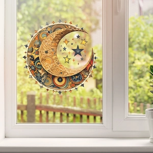 Détail d'un sticker mural 3D bohème soleil lune et étoiles sur un cadre de fenêtre blanc