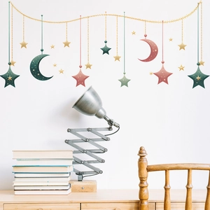 Detailed view of Morandi-style star and moon wall stickers in a cozy home office setting