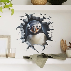 3D wall sticker with a cute penguin appearing through a cracked wall hole for home decor