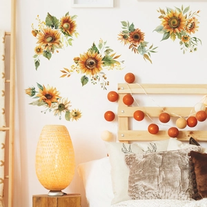 Detailed view of hand-painted sunflower wall decals in a warm bedroom setting