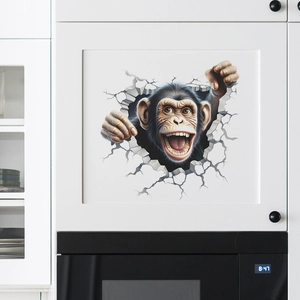 Realistischer 3D-Gorilla-Wandaufkleber bricht durch einen weißen Schrank in der Küche