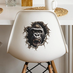 Detaillierter 3D-Gorilla-Wandaufkleber mit realistischem Durchbrucheffekt auf Möbeln