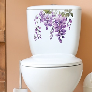 Waterproof purple wisteria floral sticker applied on white ceramic toilet tank surface