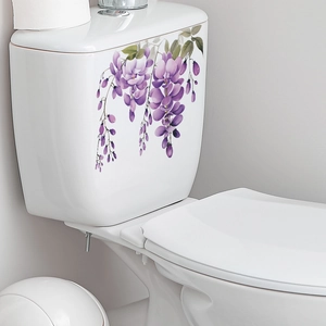Detail view of purple wisteria flower stickers on a white bathroom toilet tank surface