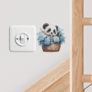 Close-up of cute panda and blue flowers wall sticker applied next to a light switch