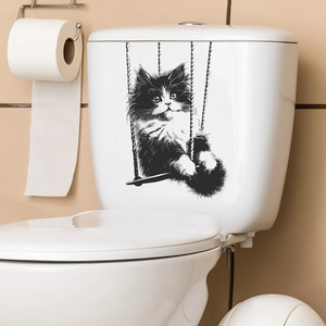 Vue détaillée du sticker chat sur balançoire sur un réservoir de toilette blanc