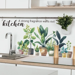 Detail showing watercolor potted plants and kitchen quote stickers on wall