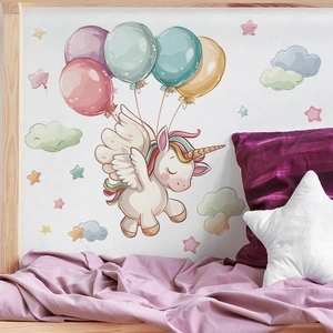 Nursery wall sticker with unicorn, colorful balloons, stars, and clouds on white bedroom wall