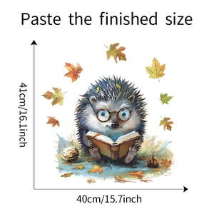 Size diagram of cartoon hedgehog window decal reading a book with autumn maple leaves