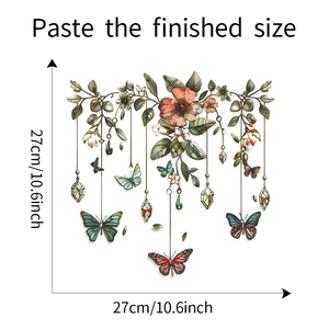 Detail of botanical wall sticker featuring green leaves, butterflies and geometric pendants