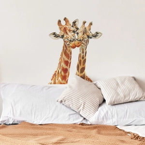 Detailed view of watercolor giraffe wall sticker in a cozy bedroom setting