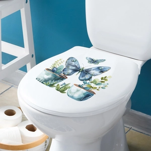 Macro shot of blue butterflies and green plants watercolor stickers on a toilet lid