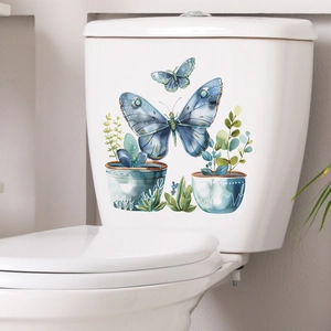 Self-adhesive watercolor butterfly and green plant decal on a white toilet tank