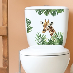 Détail d'un sticker girafe et feuilles tropicales imperméable pour toilettes de salle de bain