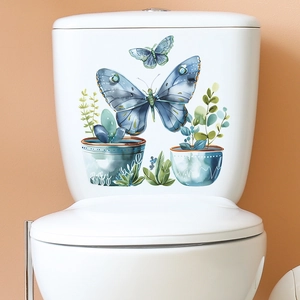 Watercolour blue butterfly and potted plant wall sticker on a white toilet tank