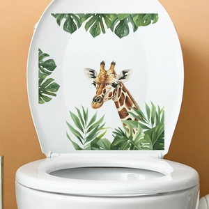 Stickers de girafe de dessin animé et plantes vertes tropicales sur couvercle de WC blanc